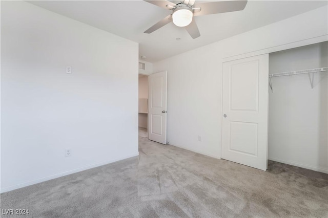 unfurnished bedroom with carpet floors, visible vents, baseboards, a ceiling fan, and a closet