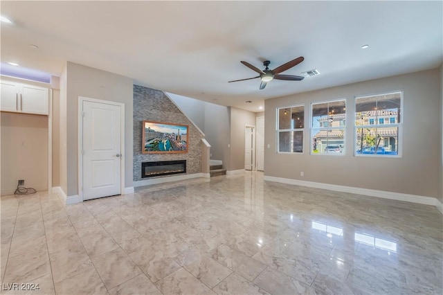 unfurnished living room featuring a ceiling fan, visible vents, stairs, marble finish floor, and baseboards