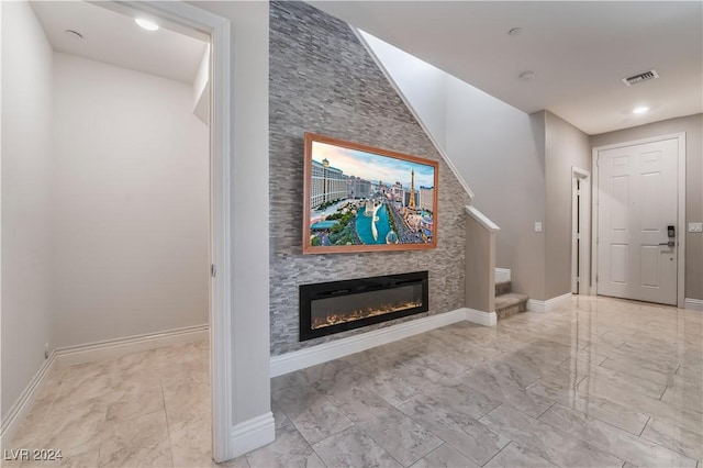 unfurnished living room featuring a fireplace