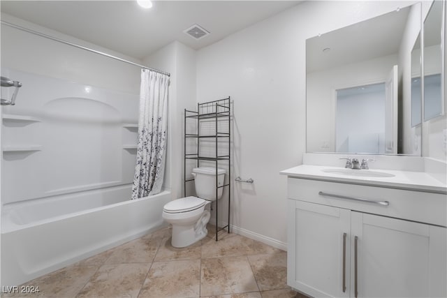 full bathroom featuring shower / tub combo, vanity, and toilet