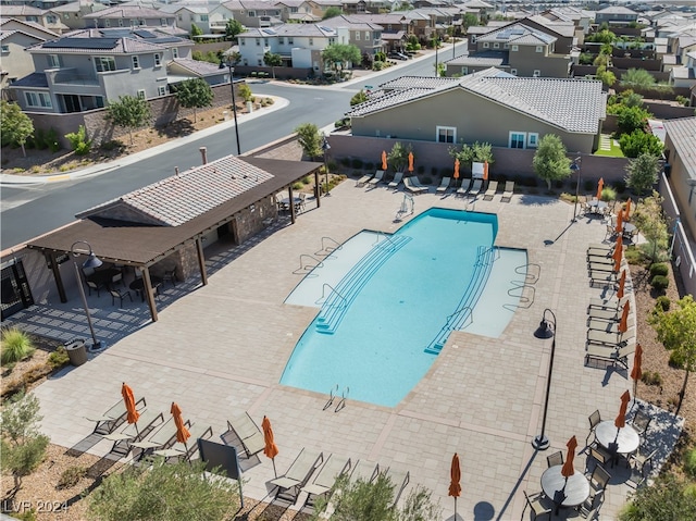 view of swimming pool featuring a patio area