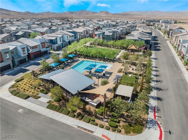 birds eye view of property featuring a mountain view and a residential view