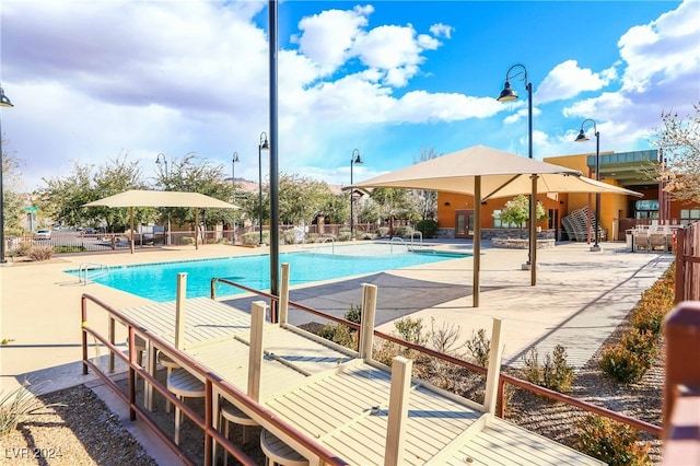 view of swimming pool featuring a patio area