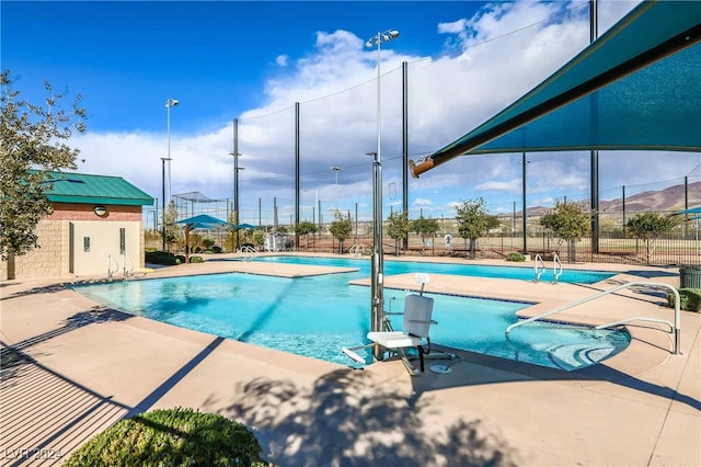 view of swimming pool featuring a patio area