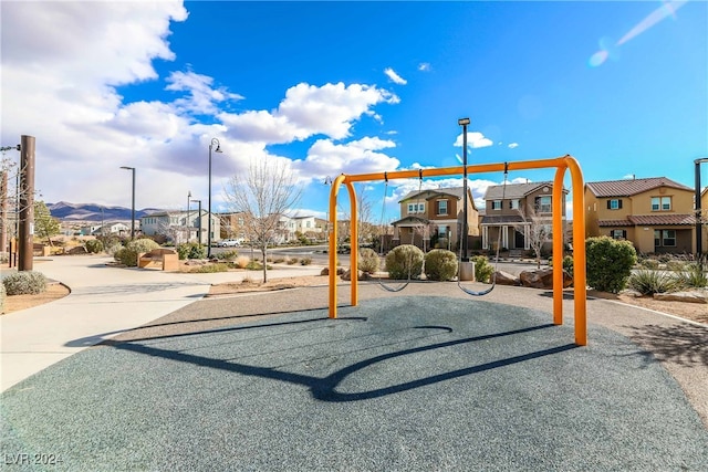 view of playground featuring a residential view