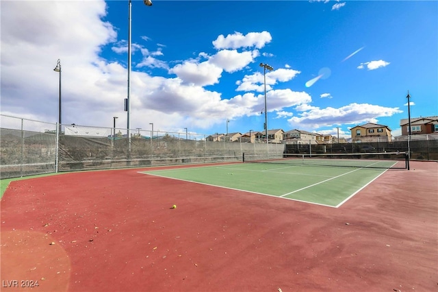 view of sport court with fence