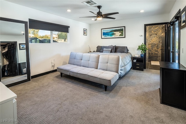 bedroom featuring ceiling fan and carpet