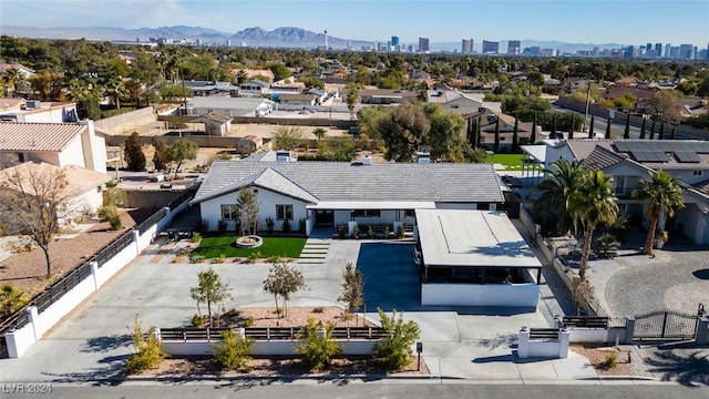 birds eye view of property with a mountain view