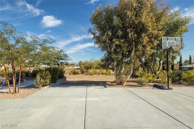 view of patio / terrace with basketball hoop