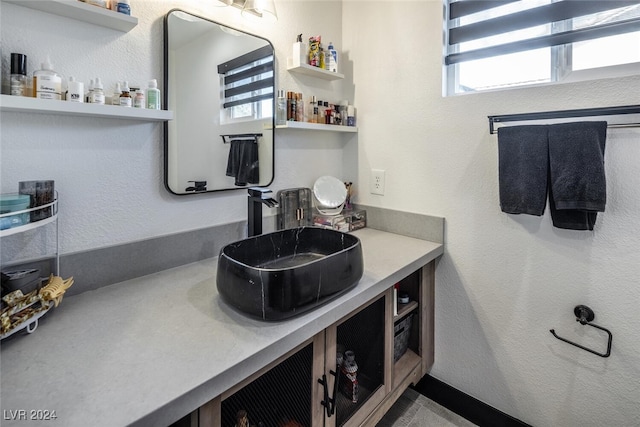 bathroom with vanity and a healthy amount of sunlight