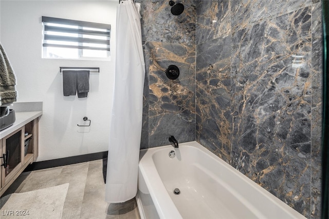 bathroom featuring vanity and shower / tub combo with curtain