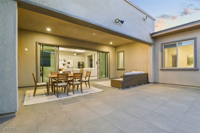 view of patio terrace at dusk