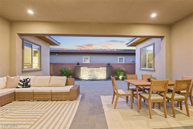 patio terrace at dusk with an outdoor hangout area