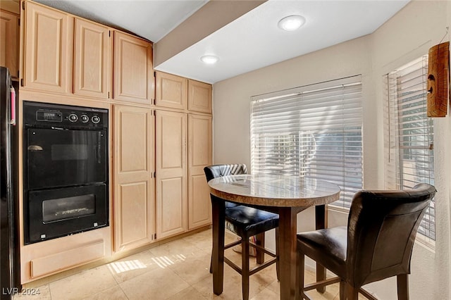 dining room with light tile patterned floors