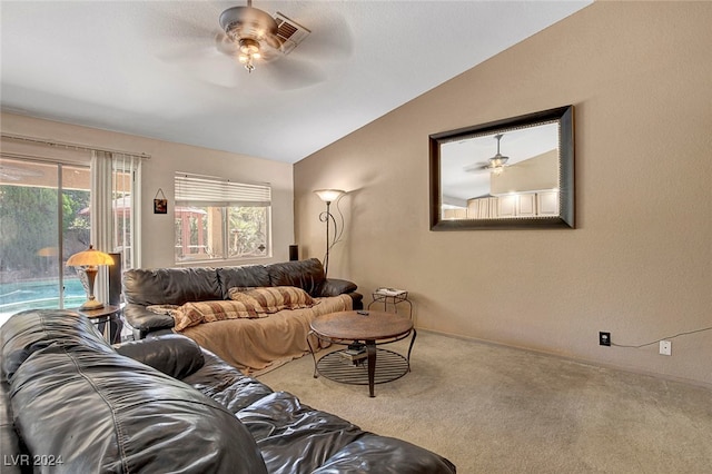 living room featuring carpet, lofted ceiling, and ceiling fan