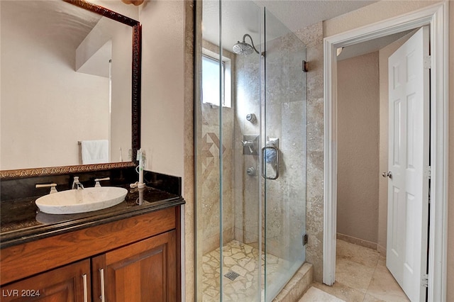 bathroom with an enclosed shower and vanity