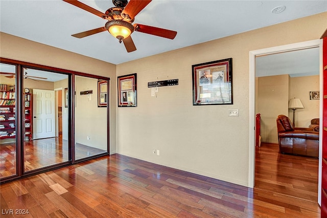 unfurnished room featuring hardwood / wood-style floors and ceiling fan