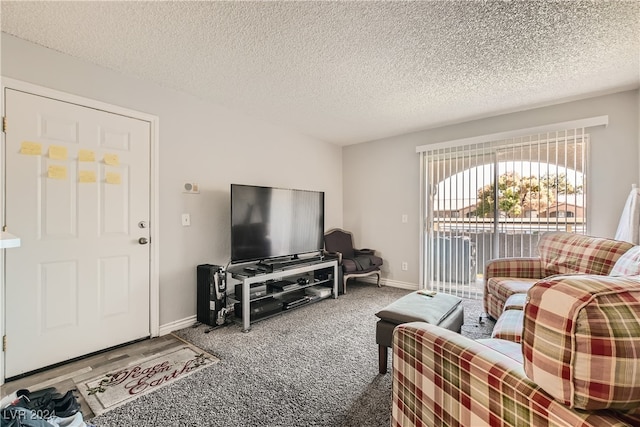 carpeted living room featuring a textured ceiling