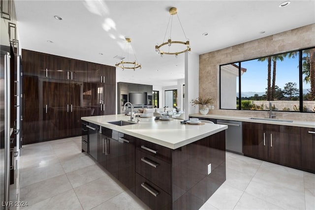 kitchen with plenty of natural light, modern cabinets, appliances with stainless steel finishes, and a sink