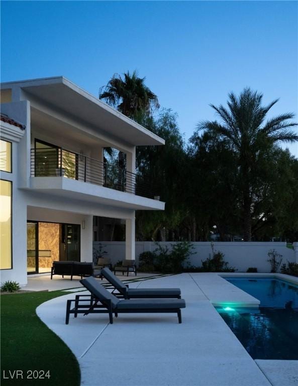 view of swimming pool with a patio, fence, and a fenced in pool