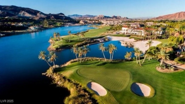 bird's eye view featuring a water and mountain view and view of golf course