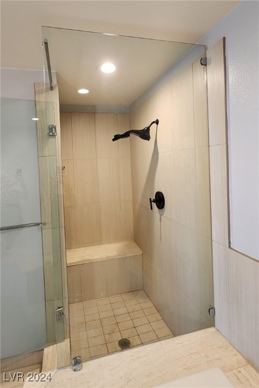 bathroom with tiled shower