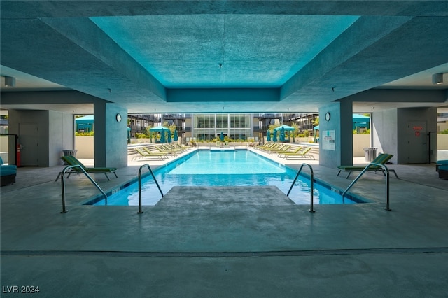 view of pool featuring a patio