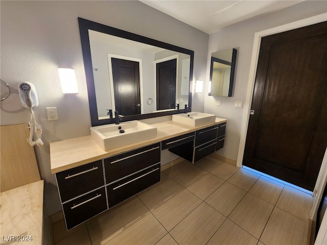 bathroom featuring tile patterned flooring and vanity