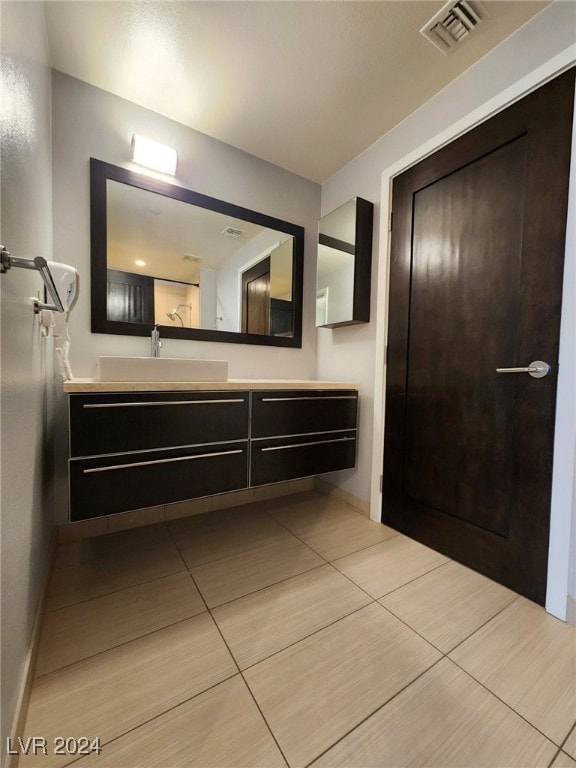 bathroom with vanity and tile patterned floors