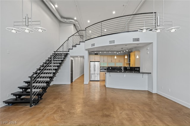 interior space featuring a towering ceiling