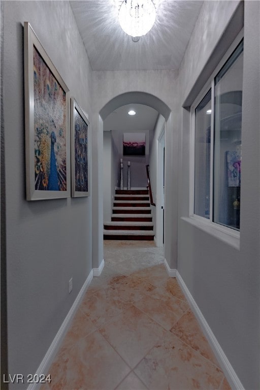 corridor with light tile patterned floors