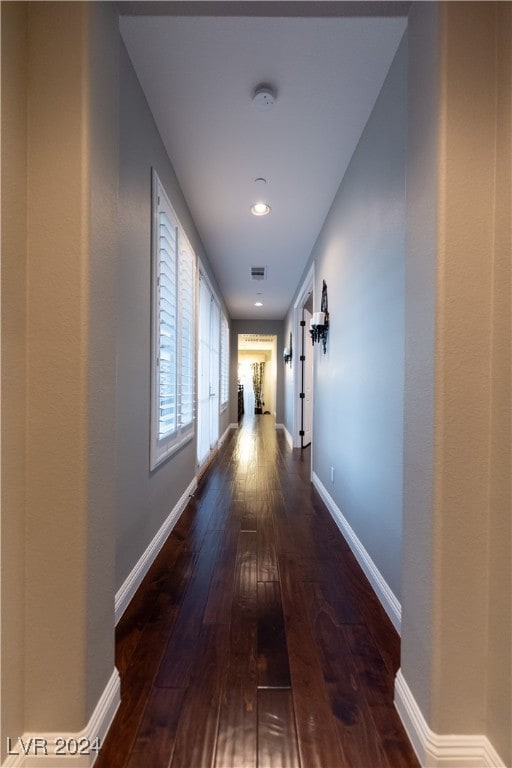 hallway featuring dark hardwood / wood-style flooring