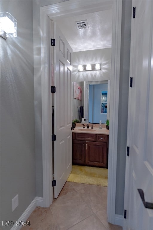 bathroom featuring vanity and tile patterned flooring