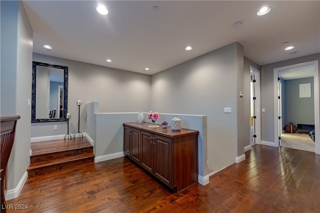 hallway featuring dark hardwood / wood-style flooring