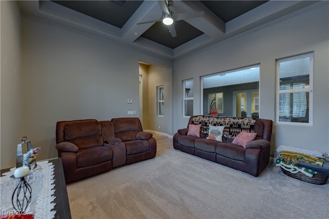 carpeted living room with ceiling fan and coffered ceiling