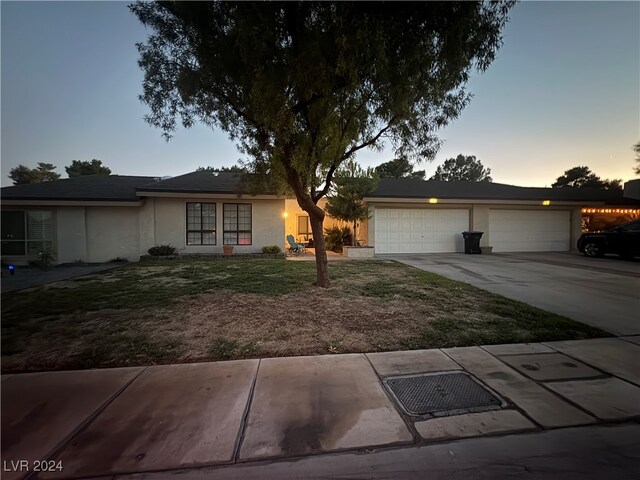 single story home featuring a garage