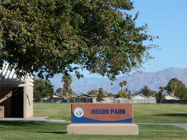 view of property's community with a yard and a mountain view