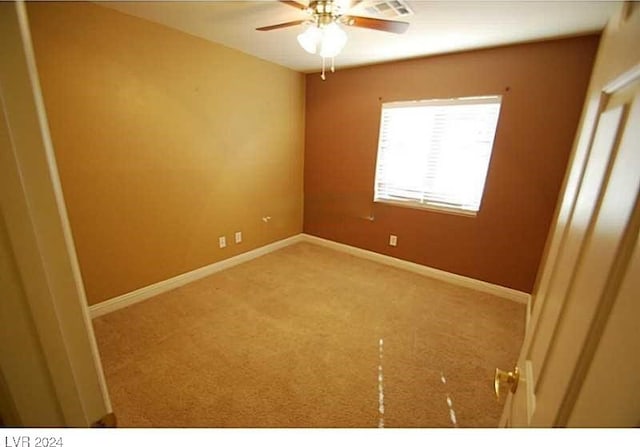 empty room with carpet and ceiling fan