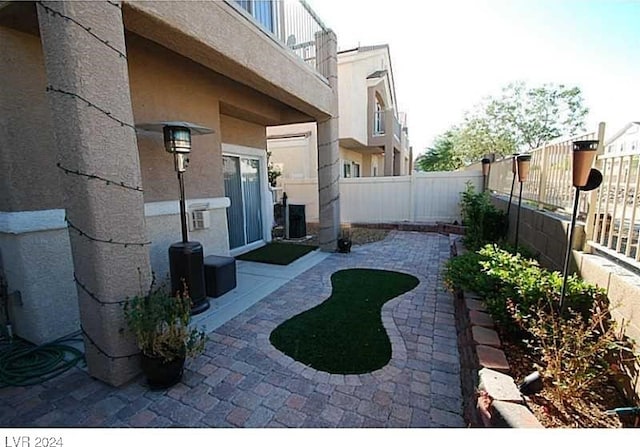 view of yard featuring a patio and central AC unit