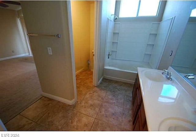 bathroom featuring tile patterned flooring, vanity, and shower / bath combination