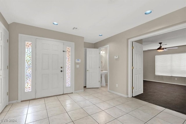 entrance foyer featuring light tile patterned floors, ceiling fan, baseboards, visible vents, and recessed lighting
