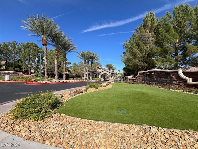 view of home's community with a lawn