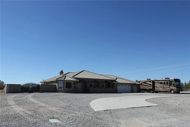 ranch-style home featuring a garage