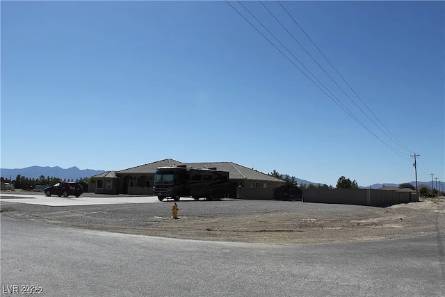 view of front of home featuring a mountain view