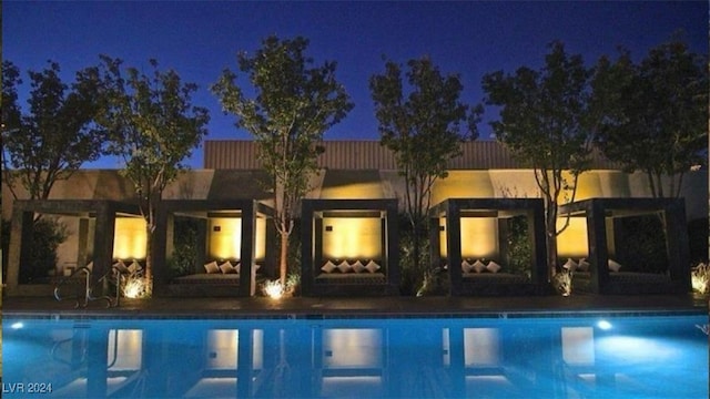 4471 Dean Martin Dr Unit 606, Las Vegas, NV 89103 - pool at twilight with an outdoor pool