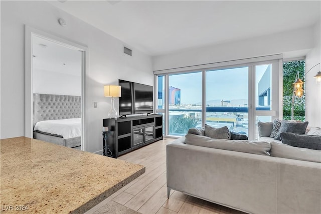 4471 Dean Martin Dr Unit 606, Las Vegas, NV 89103 - living room featuring light wood-style flooring
