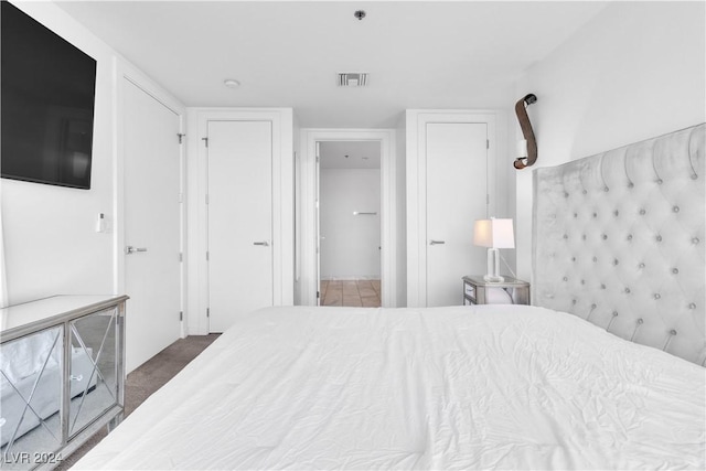 unfurnished bedroom featuring dark colored carpet