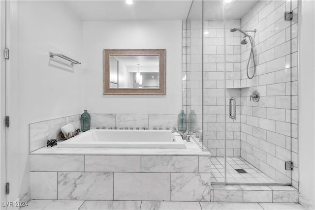 4471 Dean Martin Dr Unit 606, Las Vegas, NV 89103 - full bath with a stall shower and a garden tub