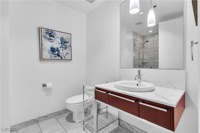 4471 Dean Martin Dr Unit 606, Las Vegas, NV 89103 - bathroom with vanity, marble look tile flooring, and a tile shower