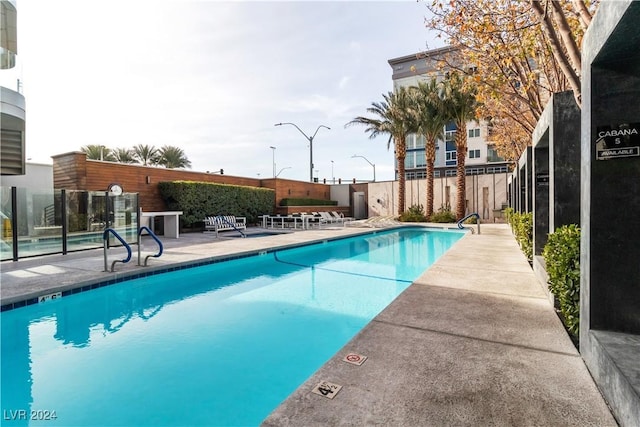 view of swimming pool with a patio